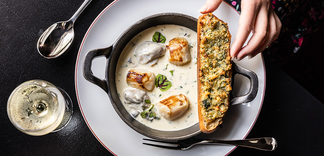 Scallop and oyster pan roast with coral crostini